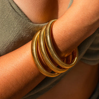 Gold Earthbound Bangle with 18K plating, root-inspired design, hypoallergenic, and water-resistant.