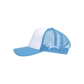 April Full Circle Trucker cap in blue and white with front print and side embroidery.