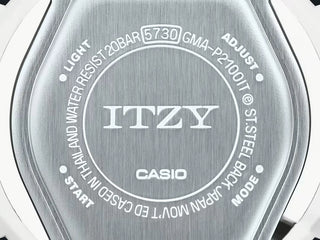 Beige G-SHOCK x Itzy watch, colorful dial indices, bio-based resin band.