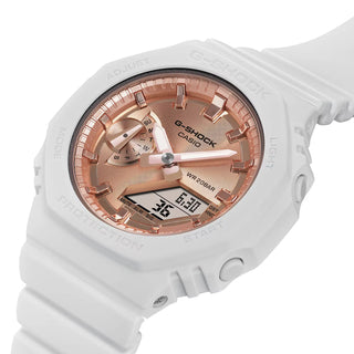 G-SHOCK watch with pink gold dial, minimalist design, and durable resin band.