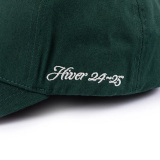 Forest Green strapback cap with chain-stitch embroidery and cotton construction.