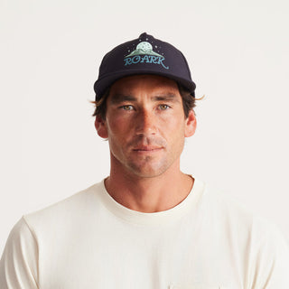 Roark Hybro Strapback Hat with breathable fabric and adjustable fit, designed for outdoor activities.