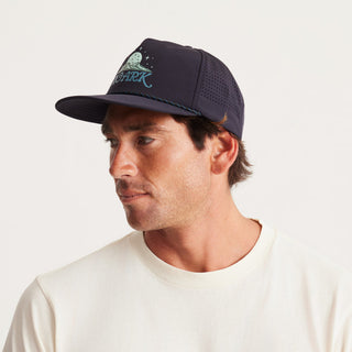 Roark Hybro Strapback Hat with breathable fabric and adjustable fit, designed for outdoor activities.