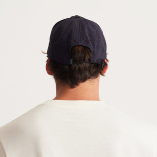 Roark Hybro Strapback Hat with breathable fabric and adjustable fit, designed for outdoor activities.