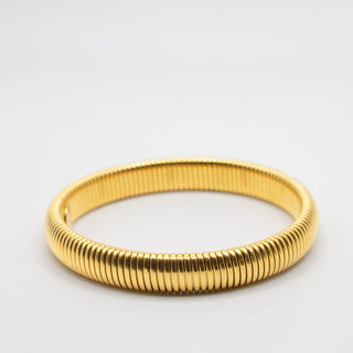 Gold Earthbound Bangle with 18K plating, root-inspired design, hypoallergenic, and water-resistant.