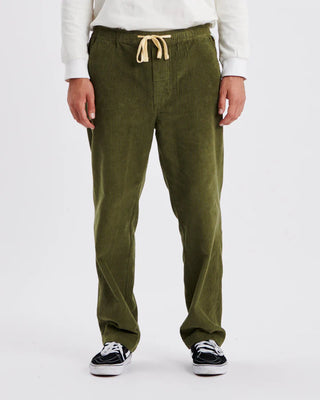 Critical Slide Society Fever Pant in Olive, straight-leg fit with elastic waist, drawcord, and 8 wale cotton corduroy.