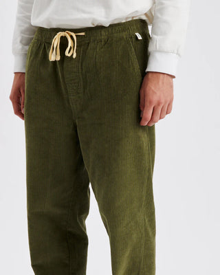 Critical Slide Society Fever Pant in Olive, straight-leg fit with elastic waist, drawcord, and 8 wale cotton corduroy.