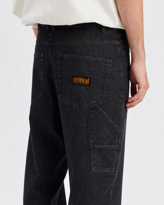 Black denim carpenter-style pant with straight leg and full-length fit.