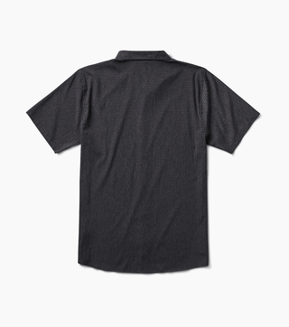 Roark Bless Up Shirt in black, lightweight perforated design, soft rubberized buttons, moisture-wicking Tactel™ fibers, short sleeve fit.