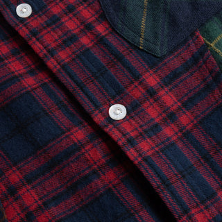 Multi-colored plaid shirt with wavy seams and embroidered chest pocket.