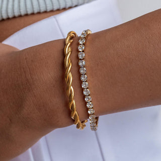 Gold Hemingway bracelet with 18K gold-filled finish, cubic zirconia, fold-over clasp, and hypoallergenic design.