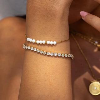 Gold Hemingway bracelet with 18K gold-filled finish, cubic zirconia, fold-over clasp, and hypoallergenic design.