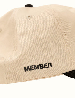 Unstructured cotton twill hat with plastic stay front and branding.