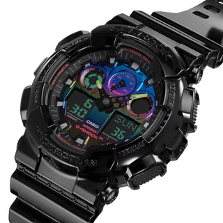 G-SHOCK GA100RGB-1A watch with glossy black bezel, multicolored face, and LED light.